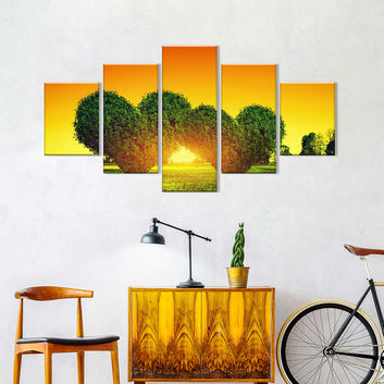 Two Green Heart Shaped Trees at Sunset Canvas Wall Art