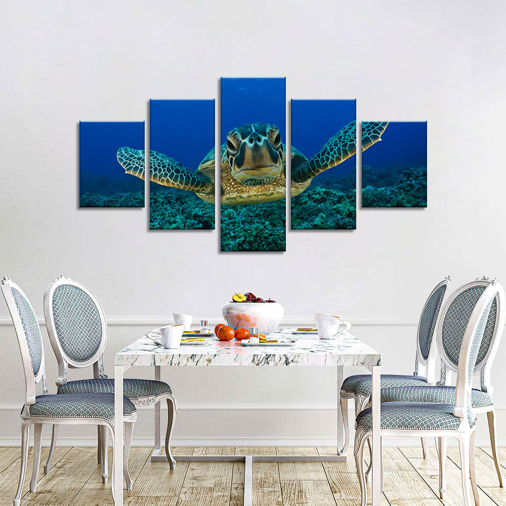 Sea turtle swimming in blue ocean canvas wall art