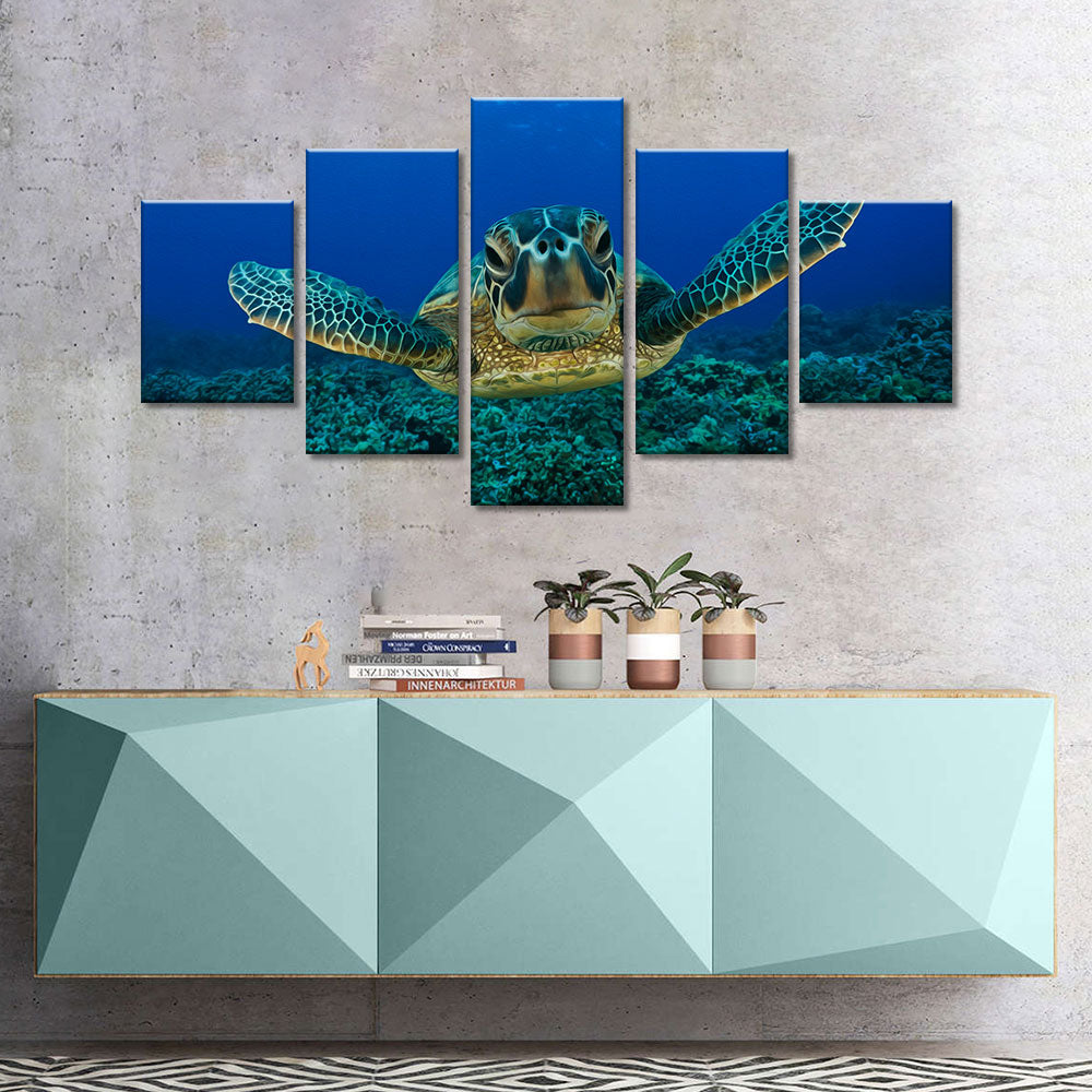 Sea turtle swimming in blue ocean canvas wall art