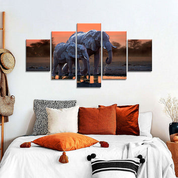 Elephant Walking with Baby in Sunset Canvas Wall Art