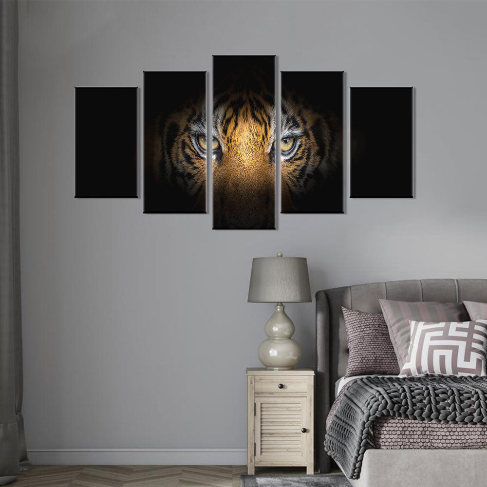 Tiger face on black background canvas wall art